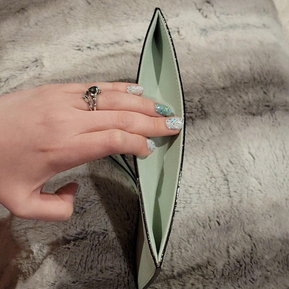 kate spade mint green wristlet clutch with gold logo